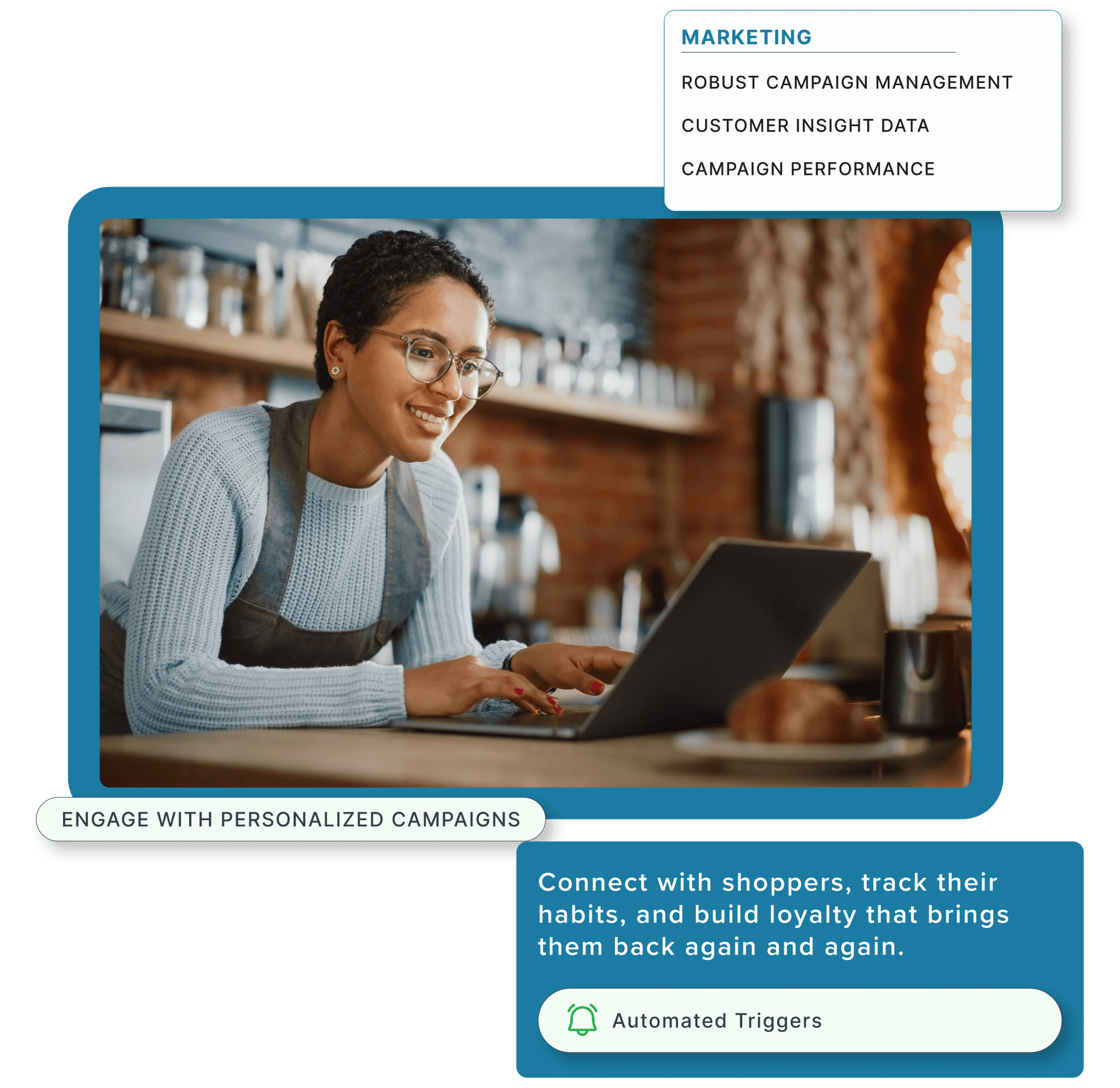 Two restaurant employees using a laptop computer.