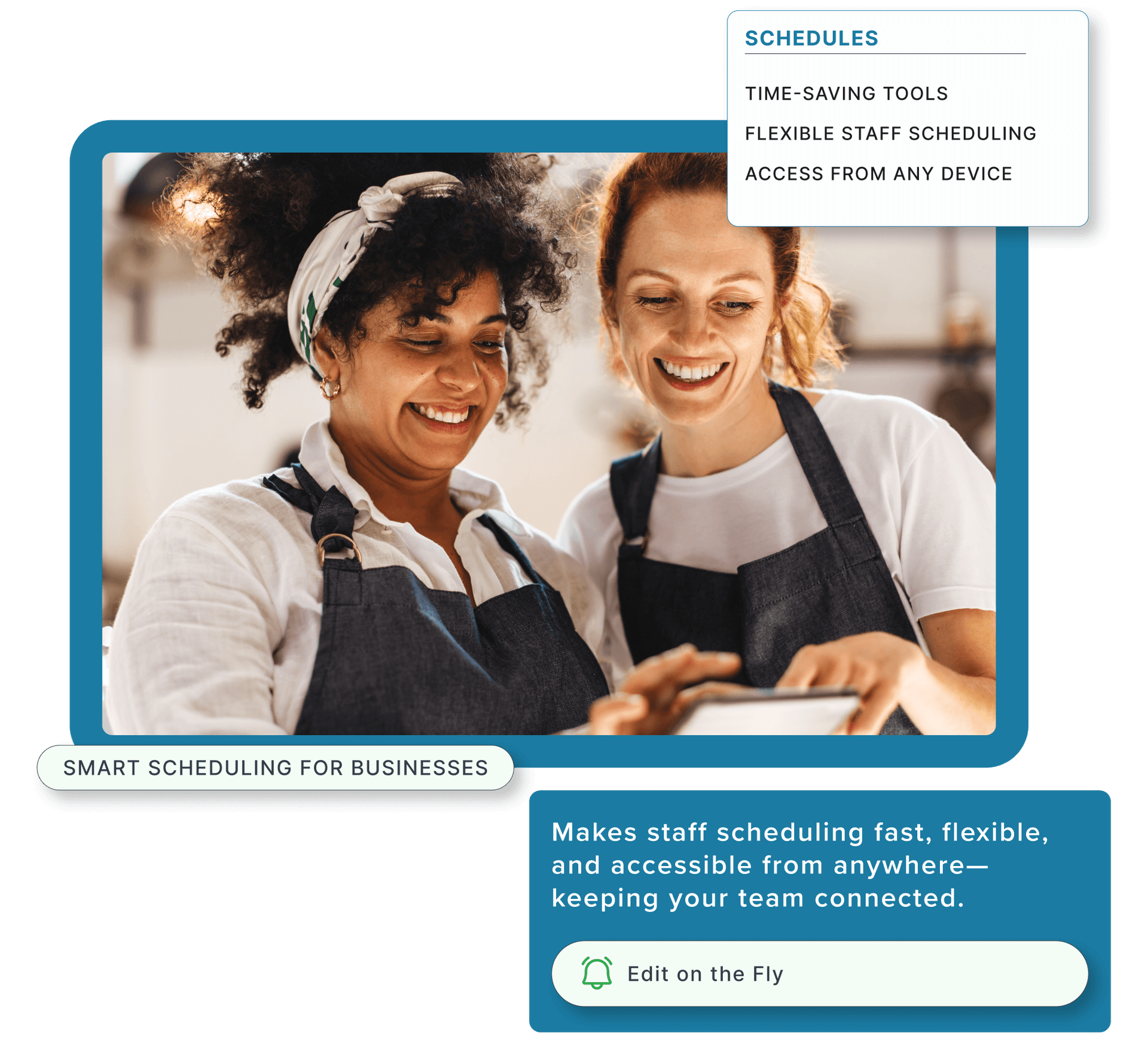 Two smiling restaurant employees using a tablet.